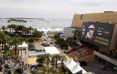 A general view of the Festival Palace covered by official poster for the 61st Cannes Film Festival